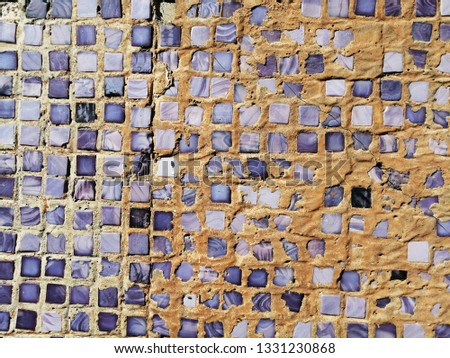 Ceramic tile wall. Old mosaic. Texture. Abstract background.