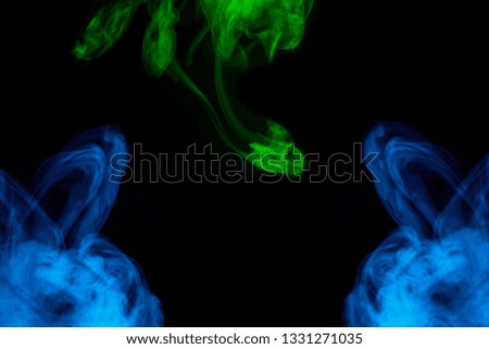 mystical blue and green cloud of cigarette vapor various exciting patterns close-up on a dark background abstraction for design smoking conception
