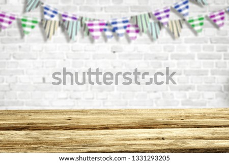Wooden desk of free space for your decoration. White wall background and spring decoration. Easter time. 