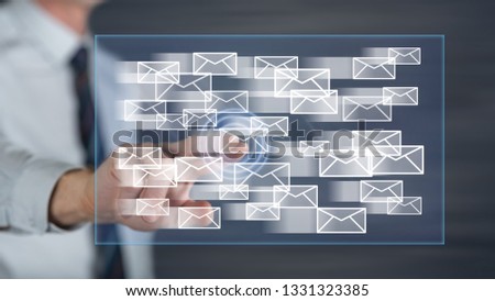 Man touching an e-mail concept on a touch screen with his finger
