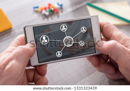 Global business network concept on mobile phone