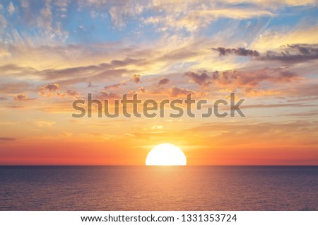 Big sun and sea sunset background. Nature composition. Royalty-Free Stock Photo #1331353724