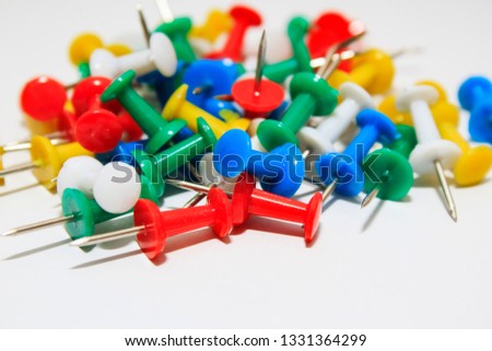  Colorful pushpins on white background