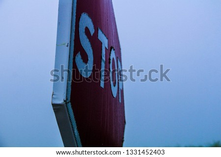 Stop traffic signal with a grey ski 