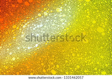 Colorful drops of oil on the water. Colored circles, ovals. Abstract bright background for design.