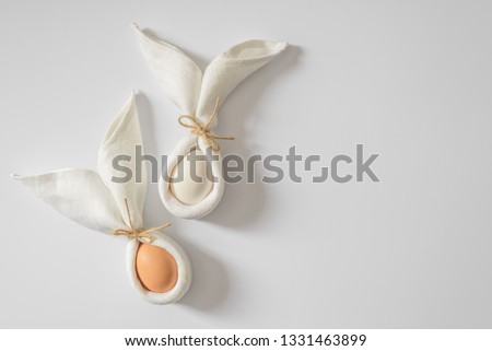 Decoration Happy Easter concept. Minimalism white cloth same bunny or rabbit for gift or present on white background.  Royalty-Free Stock Photo #1331463899