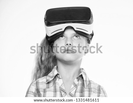 Happy kid use modern technology virtual reality. Virtual education for school pupil. Get virtual experience. Girl cute child with head mounted display on white background. Virtual reality concept.