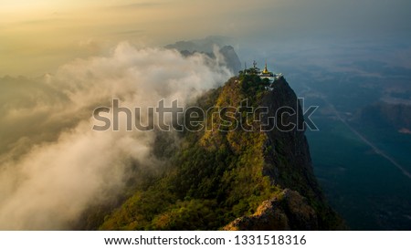 Epic picture at sunrise of monastir in the Mount Zwegabin in Hpa-An, Myanma. Amazing aerial view during sunrise at mountain Zwegabin 