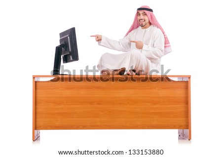 Arab man sitting at his desk Royalty-Free Stock Photo #133153880