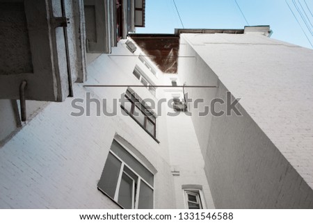 Fragment Of White Facade Of Building Or House Bottom-up View.