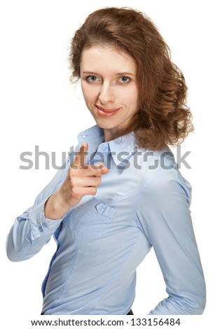Smiling young woman pointing at you