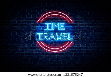 A neon sign in blue and red light on a brick wall background that reads: TIME TRAVEL