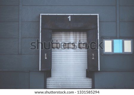 Storage gate for trucks. Commercial building, warehouse. Gate number one
