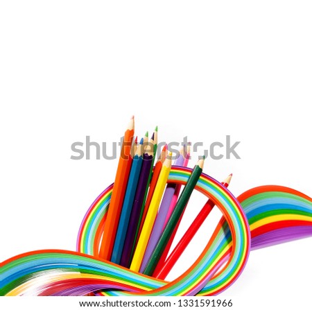 Colored thin strips of paper and colored pencils