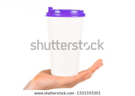 Human hands holding a paper coffee cup with color plastic cap with blank space for design logo and template for blog, social media on a white background. Delicious coffee concept
