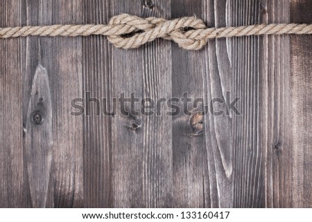 Dark wood texture with rope knot background