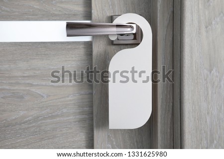Hotel door handle with blank paper hanger