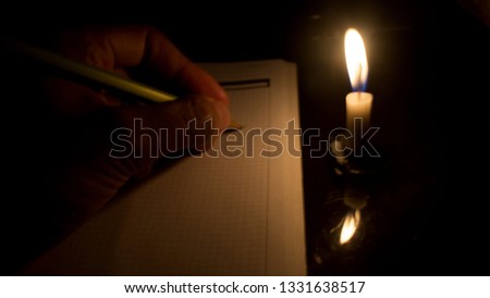 write stories under candlelight