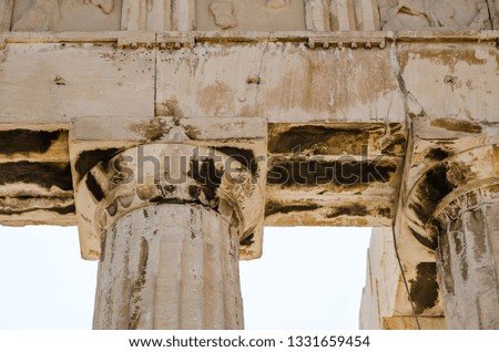 A Doric capital atop a marble column on top of the Acropolis in Athens, Greece.