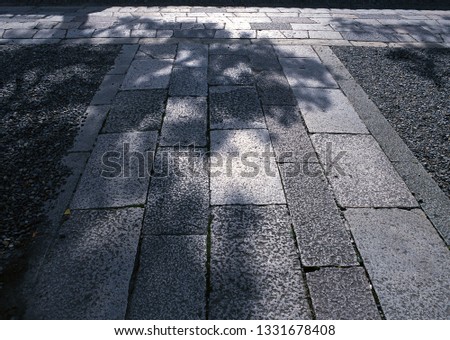 A Japanese hard black stone tile outdoor pathway flooring background
