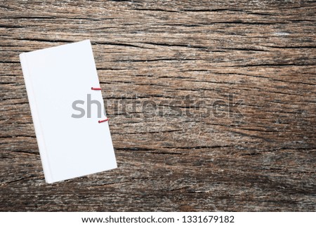 White book on wood background
