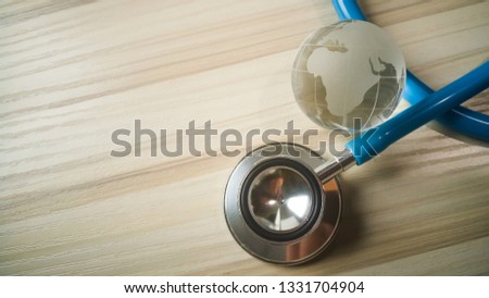 The stethoscopes on wood background image close up