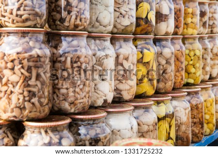 Marinated mushrooms in glass jars