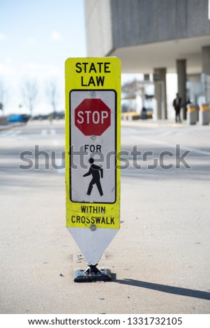 State Law Stop for Pedestrian within crosswalk street sign warning drivers 
