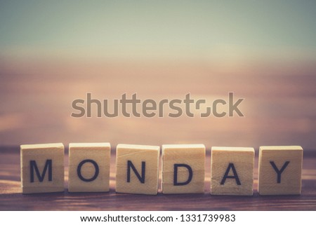 Alphabet Monday on old vintage wood background