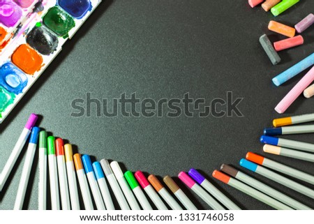 school supplies for children, colored pencils for drawing, watercolors and colorful crayons for decoration, the picture is perfect for vignetting and describing something