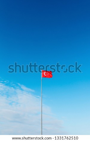 Turkish flag waving at blue sky. Turkey country flag flowing in the wind at blue sky. 