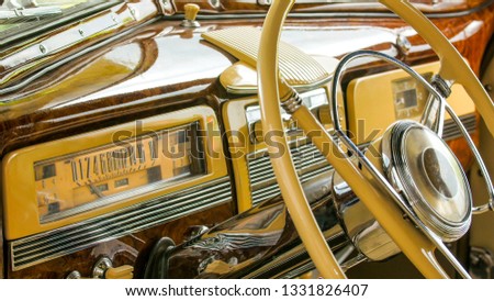 The look inside the vintage car display. The shiny car is on display on a showroom