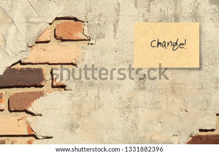 A handwritten text message on ruined cracked brick wall background : CHANGE, concept of self improvement, development