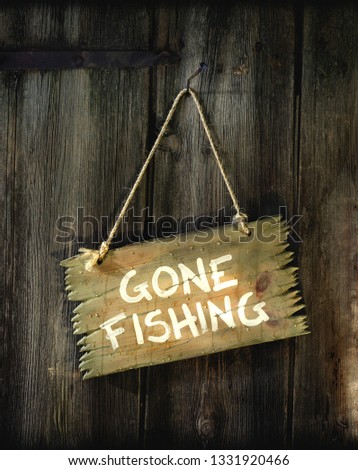 Sign "Gone fishing" hangs on the door. 