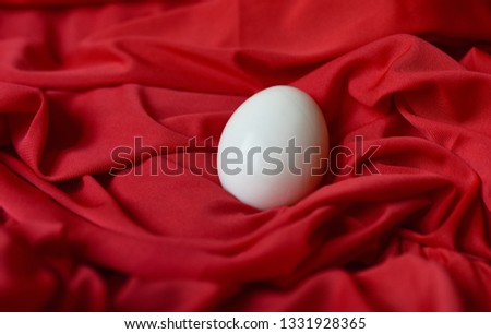 chicken boiled egg white on red fabric