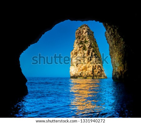 Cave entrance at Ortholithos Rock, Paxos, Ionian Sea, Greece
