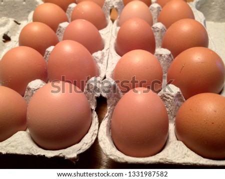 fresh brown eggs in a box
