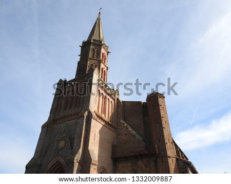 Church of St. Peter in Chains (L'église Saint-Pierre-aux-Liens), an imposing Gothic style building of red-orange bricks in the village of Le Fousseret in Haute-Garonne, Occitanie, southwestern France