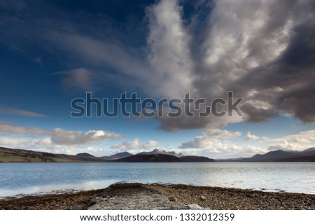 This beautiful panoramic landscape is near Tongue in Scotland pictured from the shore at the kyle with Ben Loyal mountain to the west