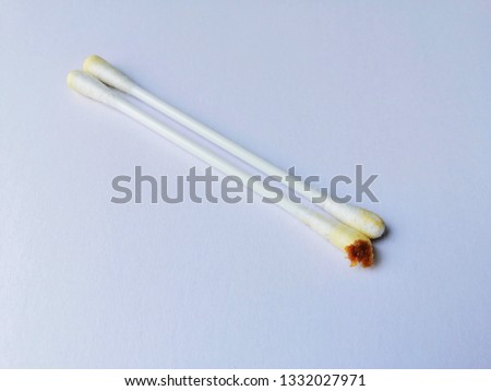 Earwax on cotton buds, on white background​