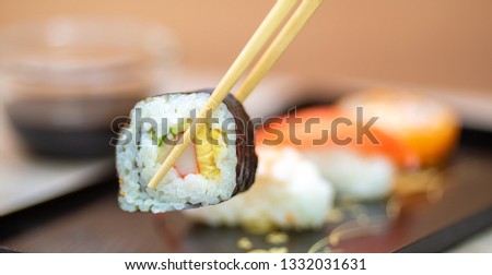 Set of sushi and maki roll  with chopsticks on table .Top view 