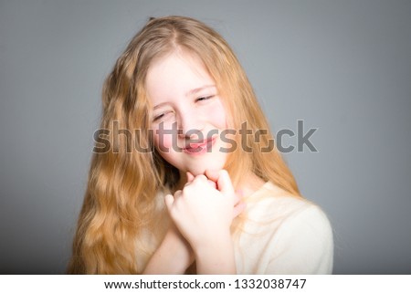 cunning little girl, studio photo on a background