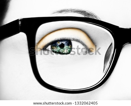 Image of a beautiful young woman wearing glasses.