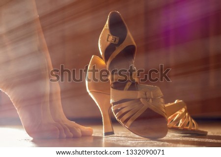 Female legs and shoes for ballroom dancing close-ups. Preparations for the performance, for the dance concept Royalty-Free Stock Photo #1332090071