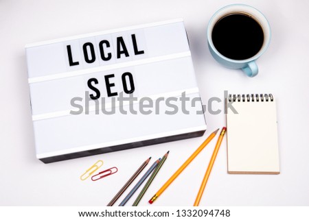 Local SEO. Text in lightbox. White desk with stationery