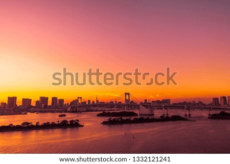 Beautiful architecture building cityscape of tokyo city with rainbow bridge at twilight sunset time in japan