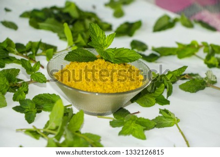 Mint leaf with powder in the bowl Royalty-Free Stock Photo #1332126815
