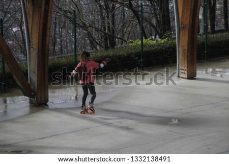 Young girl skating in the park