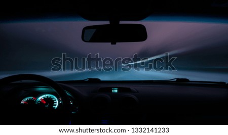 car drives a photograph on the road with a delay inside view