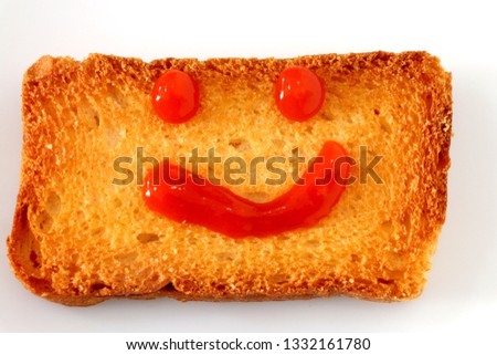 Rusk with sauce smiley  Royalty-Free Stock Photo #1332161780